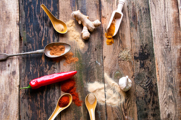 Colorful aromatic spices in old rustic kitchen