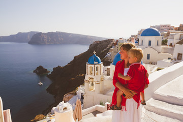 mother and son enjoying view of santorini