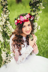 Naklejka premium Beautiful bride on a swing