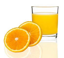 orange juice in a glass with oranges