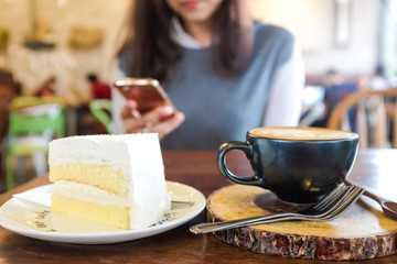 Close up of delicious butter white cake with coffe cup
