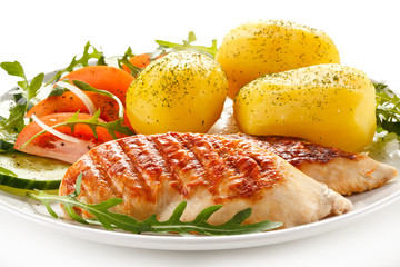Grilled chicken fillets, boiled potatoes and vegetable salad 