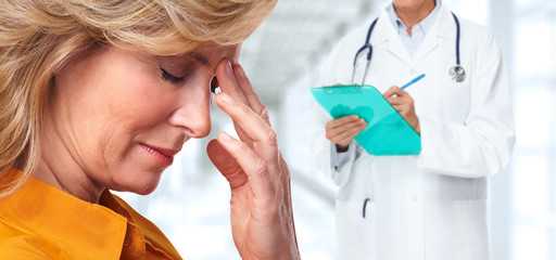 Woman having a migraine headache.