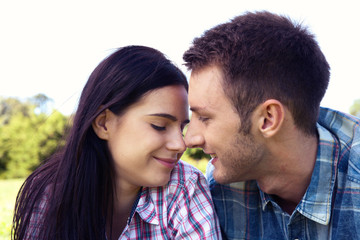 Portrait of happy young couple looking at each other.