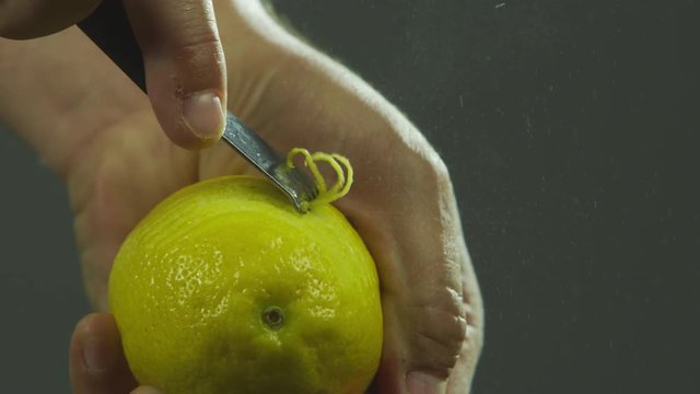 Slow motion peeling lemon skin