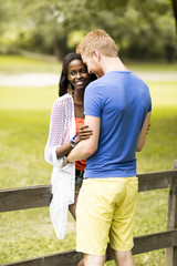 Loving couple by tge fence