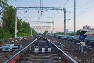 railroad tracks in the summer evening