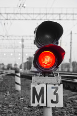 red semaphore signal on railway in spring time