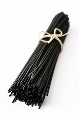 Black spaghetti with prawns isolated on white background

