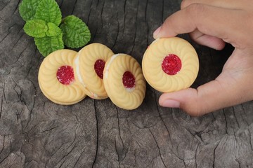 Strawberry biscuits is delicious on wood background.
