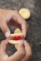 Strawberry biscuits is delicious on wood background.