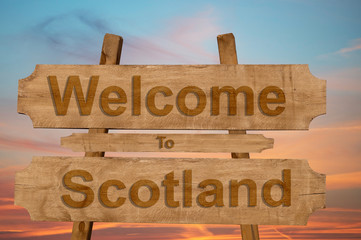 Welcome to Scotland sing on wood background