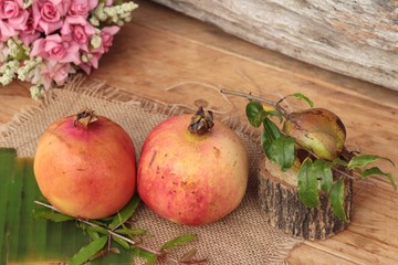 Ripe pomegranate fruit delicious on wood background.