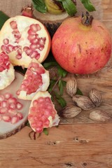 Ripe pomegranate fruit delicious on wood background.