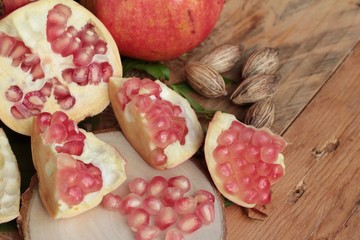Ripe pomegranate fruit delicious on wood background.