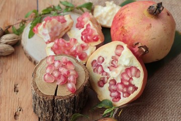 Ripe pomegranate fruit delicious on wood background.