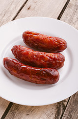 Sausage. Delicious sausages in a plate.