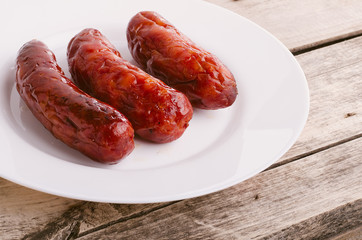 Sausage. Delicious sausages in a plate.