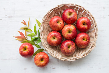 Red apple on rustic wooden table background