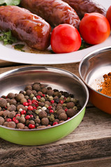 Sausage. Delicious sausages in a plate with ingredients. Salad.