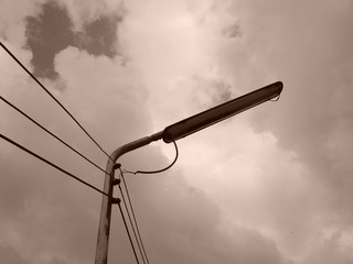 The photo of the street lamps and wires