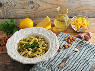 pasta spirals with cheese, almonds and Basil
