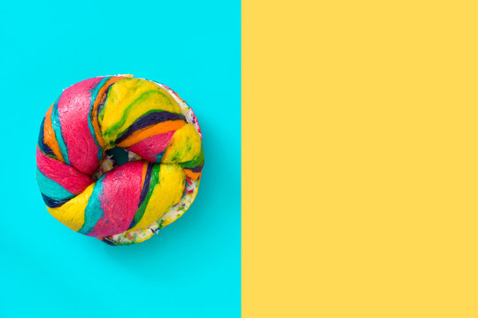 Colorful Bagel On Blue And Yellow Background

