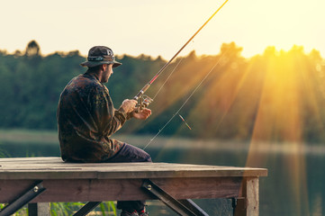 man fishes in the lakes of the Mazury