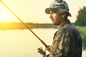 man fishes in the lakes of the Mazury