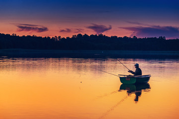 man fishes in the lakes of the Mazury - 119377664