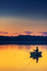 man fishes in the lakes of the Mazury - 119377681