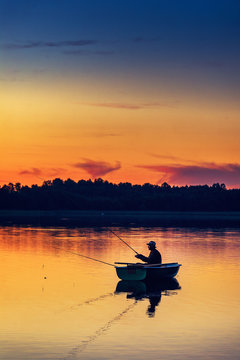 man fishes in the lakes of the Mazury