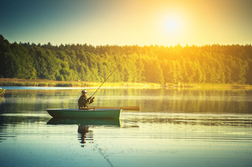 man fishes in the lakes of the Mazury