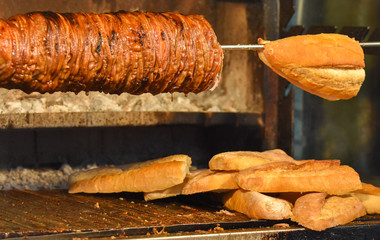 Kokorec (kokorech) roasting on the open fire. Traditional Turkish food - cooking the street food.