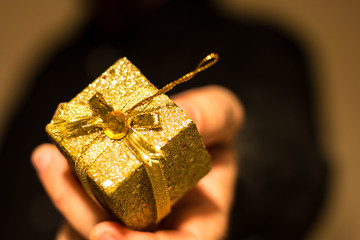 Man Giving Golden Gift
