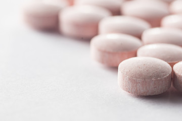 Multiple pills depicting medical treatment or pahrmaceutical ind