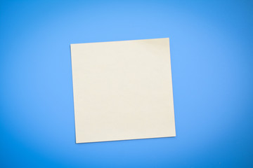 Yellow note over blue background