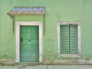 A door and window in an old building in the old royal capital of Montenegro, Cetinje
