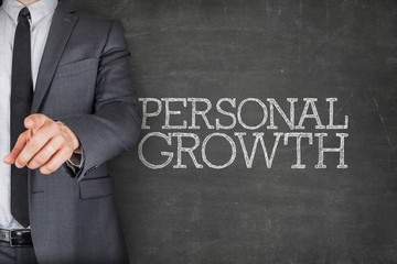 Fototapeta na wymiar Personal growth on blackboard with businessman