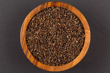 Decorticated cardamom seeds in a bowl