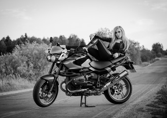 Fototapeta na wymiar Beautiful woman on the motorcycle. black and white 