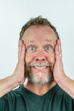 Stressed man in beard with casual clothes, crazy expression. 
