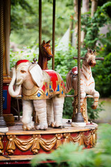 Old vintage carousel in a holiday park.