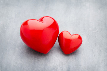 Fototapeta premium Red heart on the gray metal background.