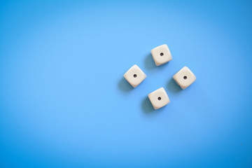 Four dice on a blue background