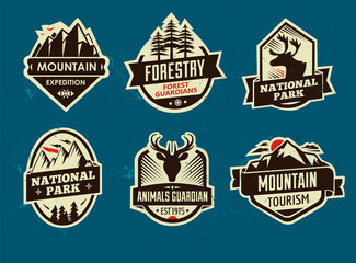 Set of mountain adventure and travel emblems