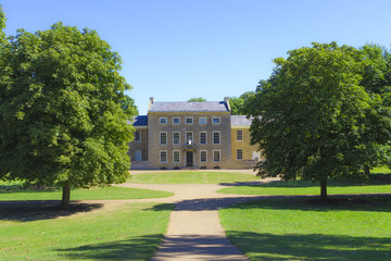 Great Linford manor complex under blue sky