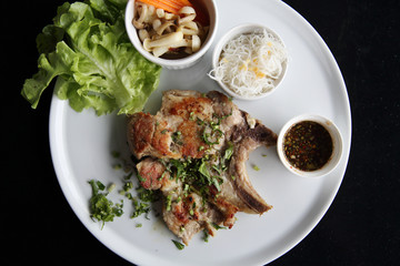 Grilled Porkchop on wood background