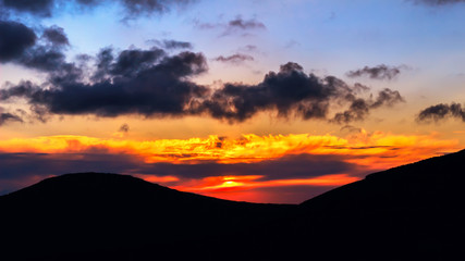 Picturesque sunrise, morning dawn in Carpathians, mountains silhouette Ukraine.