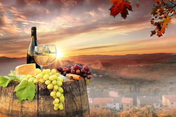 White wine with barrel on famous vineyard in Chianti, Tuscany, Italy